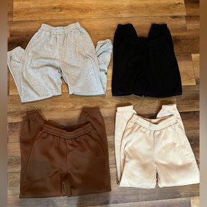 Joggers in grey, black, tan, and brown. Size small